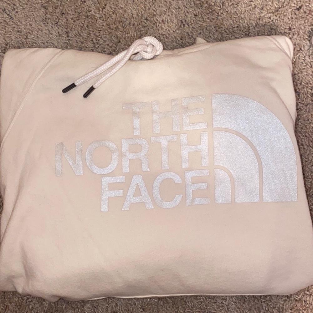 cream colored north face hoodie with silver logo. NWOT